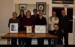 Some committee members along with Anne Flanagans family members with memorabilia.